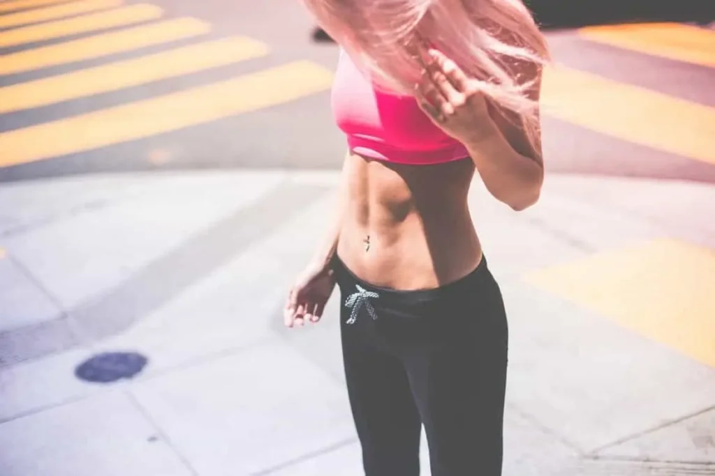 Woman with toned stomach after LA-EMS Body Sculpting Treatment Kew